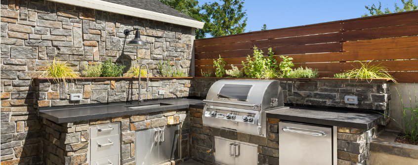 backyard hardscape patio with outdoor barbecue and kitchen