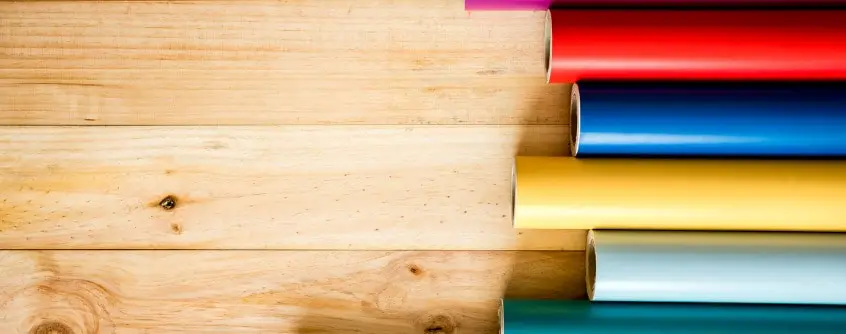 colorful vinyl rolls on wooden background