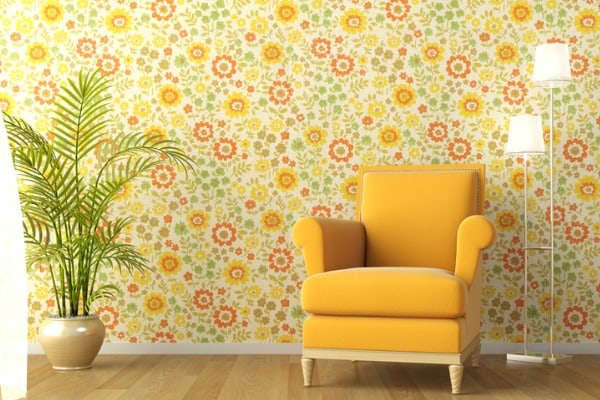 interior with armchair and flowery wallpaper